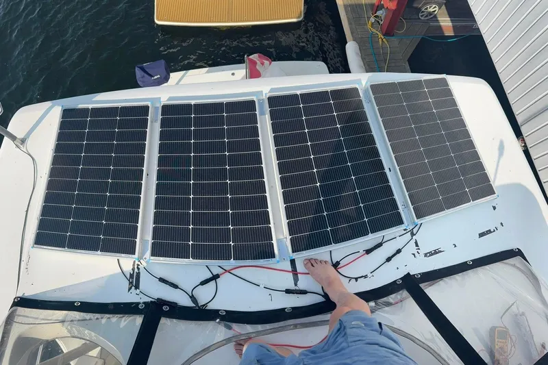 Yacht Photos Pics Solar panels on a 2000 Carver 404 Cockpit Motor Yacht, docked by the water.