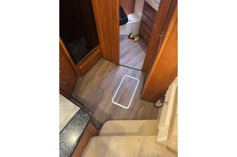  Yacht Photos Pics Interior of 2000 Carver 404 Cockpit Motor Yacht with wood flooring and cabinetry.