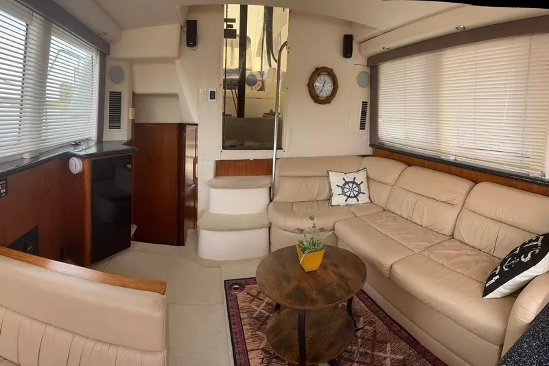  Yacht Photos Pics Luxurious interior of 2000 Carver 404 Cockpit Motor Yacht with beige leather seating.