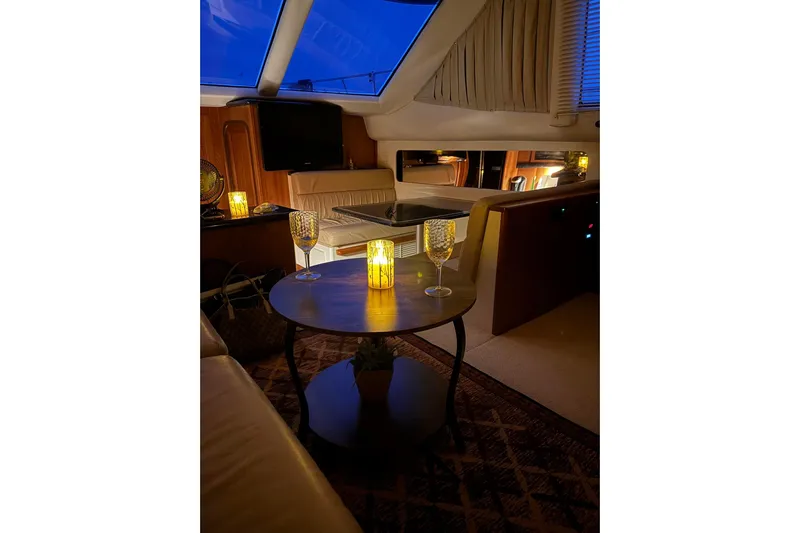  Yacht Photos Pics Luxurious interior of 2000 Carver 404 Cockpit Motor Yacht with ambient lighting and elegant decor.