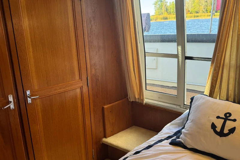  Yacht Photos Pics Interior of 2000 Carver 404 Cockpit Motor Yacht with wood paneling and nautical-themed decor.