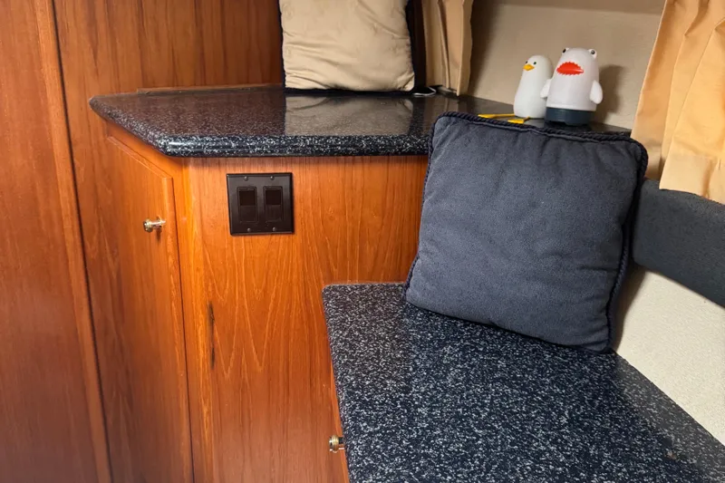  Yacht Photos Pics Interior of 2000 Carver 404 Cockpit Motor Yacht with granite countertops and cushions.