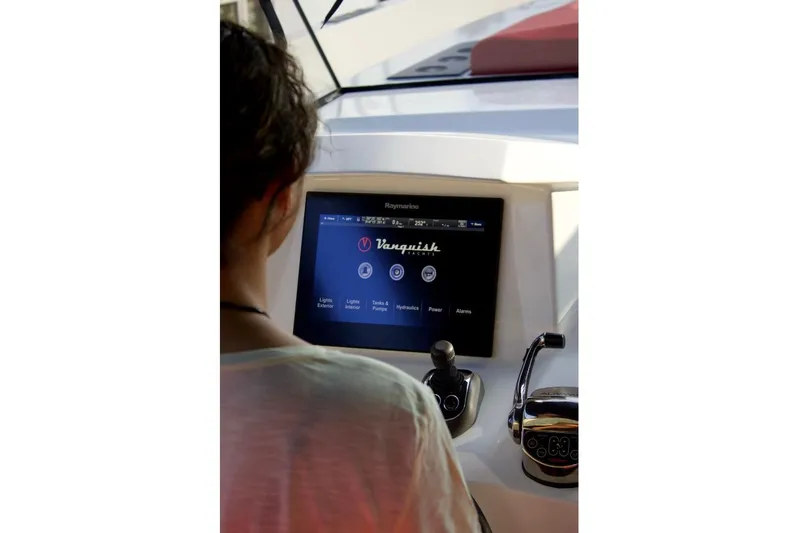 Aliyyah Yacht Photos Pics Person operating Vanquish Yachts VQ 45 control panel, 2018 model.