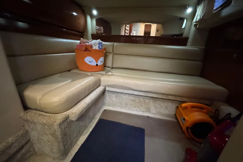  Yacht Photos Pics Interior of 2003 Sea Ray 420 Sundancer with beige seating and cozy decor.