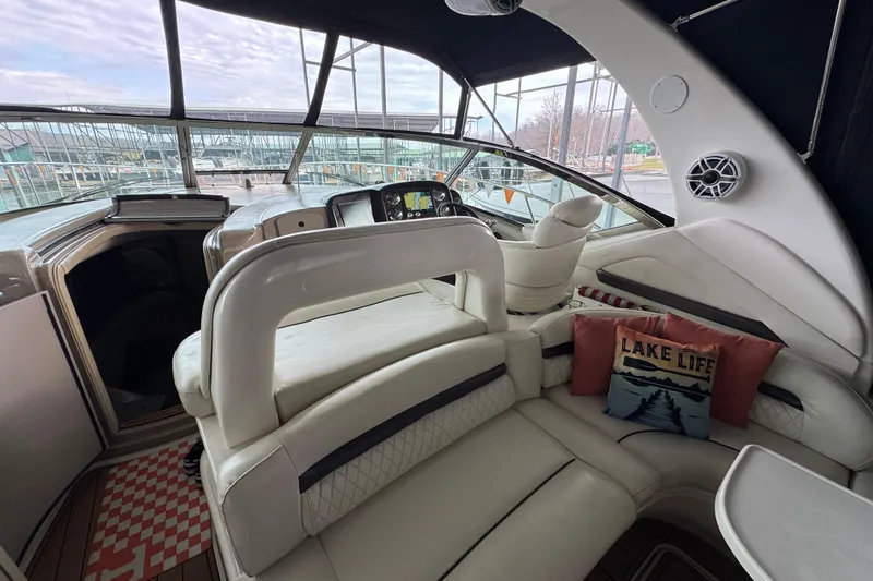  Yacht Photos Pics Interior of 2003 Sea Ray 420 Sundancer yacht with plush seating and "Lake Life" pillow.