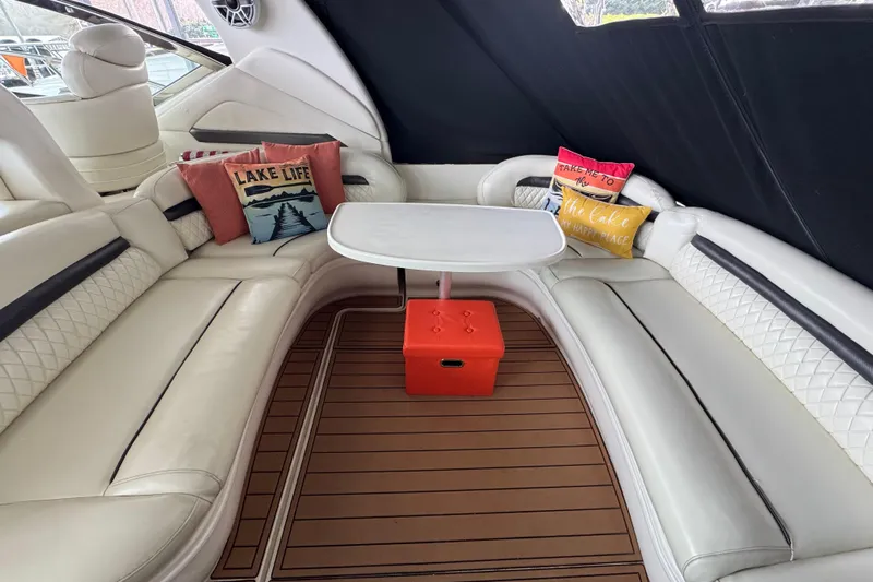  Yacht Photos Pics Luxurious 2003 Sea Ray 420 Sundancer interior with plush seating and decorative pillows.