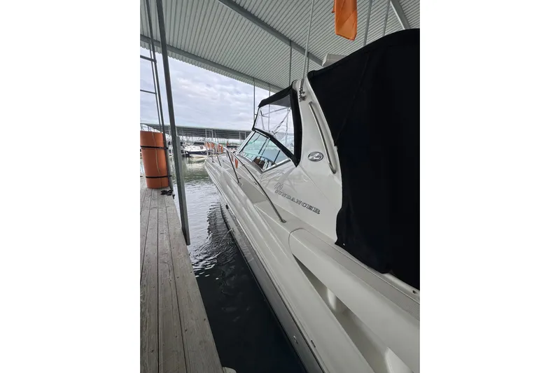  Yacht Photos Pics 2003 Sea Ray 420 Sundancer docked under a covered marina.