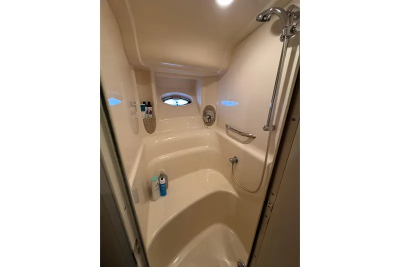  Yacht Photos Pics Shower area in 2003 Sea Ray 420 Sundancer yacht with porthole and toiletries.