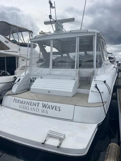 Permanent Waves Yacht Photos Pics Carver 440 Hardtop Express 2000 yacht docked, named "Permanent Waves," in Kirkland, WA marina.