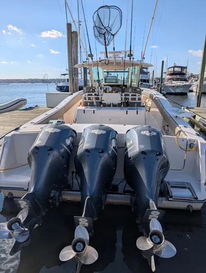  Yacht Photos Pics 2012 Grady-White Canyon 366 boat with triple Yamaha outboard engines docked at marina.