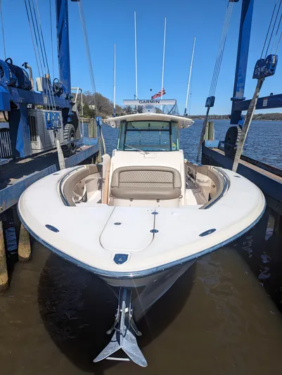  Yacht Photos Pics 2012 Grady-White Canyon 366 boat docked, front view, in a marina setting.