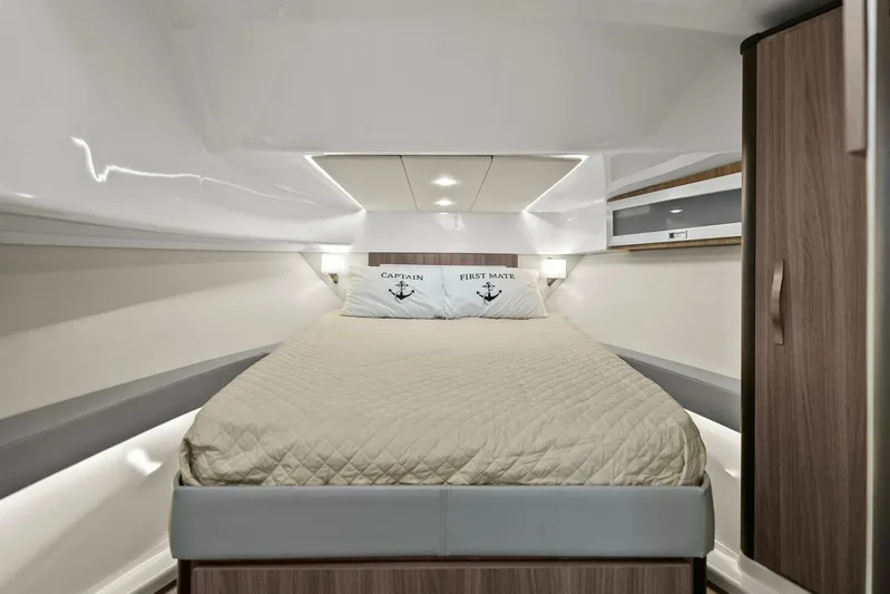 Over The Top Yacht Photos Pics Luxurious cabin interior of 2021 Regal 36 yacht with cozy bed and modern design.