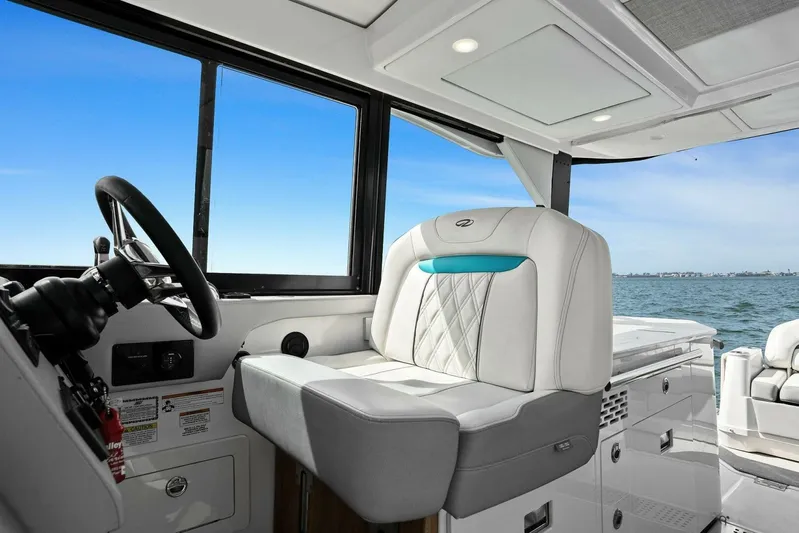 Over The Top Yacht Photos Pics 2021 Regal 36 boat interior with luxurious seating and ocean view.