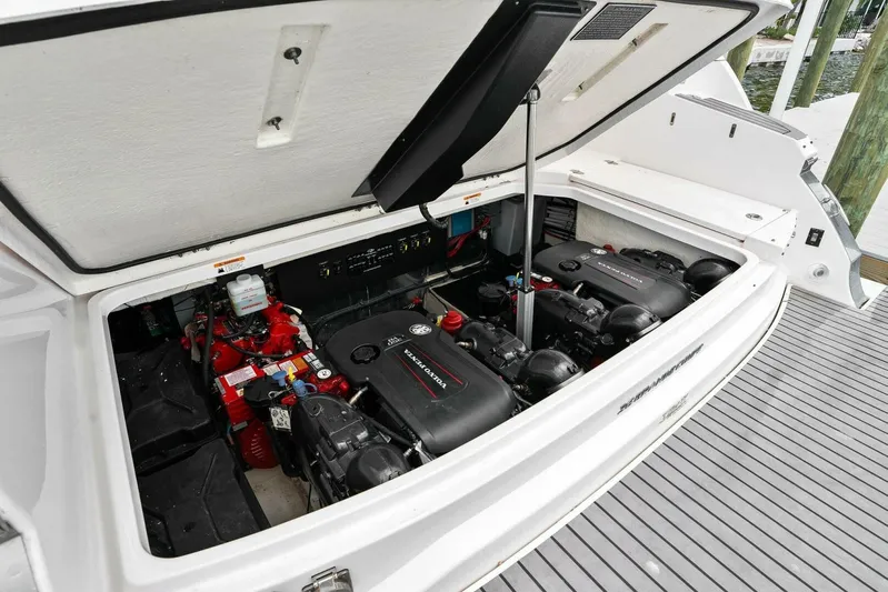 Over The Top Yacht Photos Pics Engine compartment of 2021 Regal 36 boat, showcasing dual engines and mechanical components.
