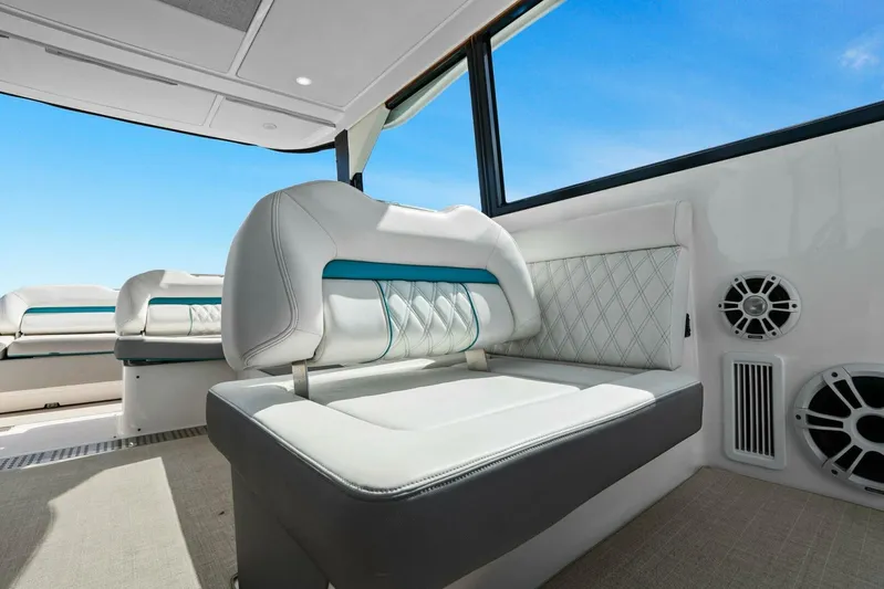 Over The Top Yacht Photos Pics Interior of 2021 Regal 36 boat with luxurious seating and modern design.