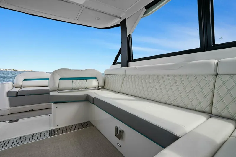 Over The Top Yacht Photos Pics Luxurious interior of 2021 Regal 36 boat with plush seating and ocean view.