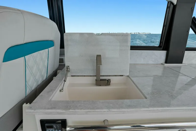 Over The Top Yacht Photos Pics Luxury yacht interior with modern sink and ocean view, Regal 36, 2021 model.