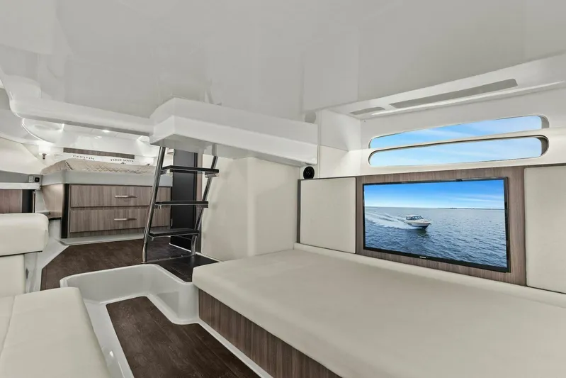 Over The Top Yacht Photos Pics Luxurious interior of 2021 Regal 36 yacht with modern furnishings and large window.