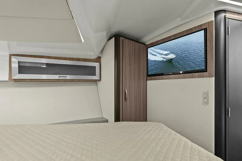 Over The Top Yacht Photos Pics Interior of 2021 Regal 36 yacht cabin with TV and modern furnishings.