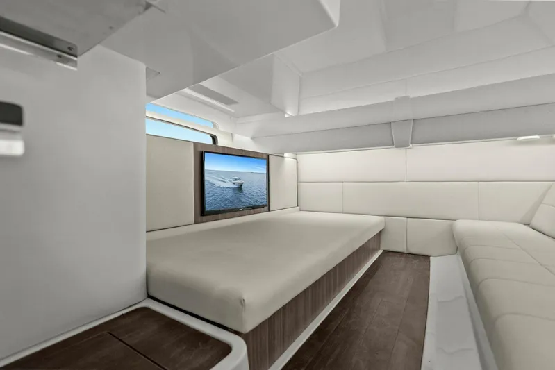 Over The Top Yacht Photos Pics Luxurious interior of 2021 Regal 36 yacht with modern seating and TV.