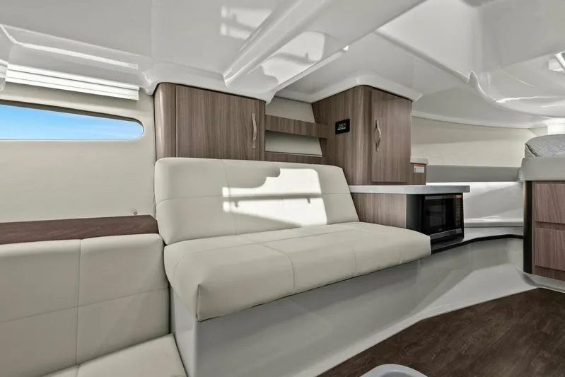 Over The Top Yacht Photos Pics Luxurious interior of a 2021 Regal 36 yacht with modern furnishings and sleek design.