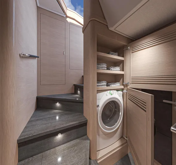  Yacht Photos Pics Laundry area in 2025 Beneteau Swift Trawler 54, featuring washer and storage shelves.