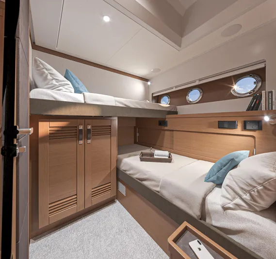  Yacht Photos Pics 2025 Beneteau Swift Trawler 54 cabin with bunk beds and modern wood finish.