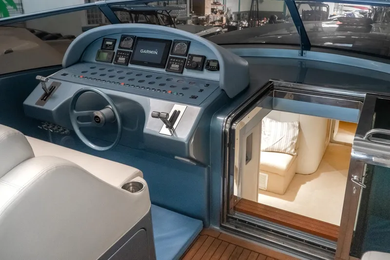  Yacht Photos Pics Cockpit of a 1997 Magnum 56 yacht with modern navigation equipment.