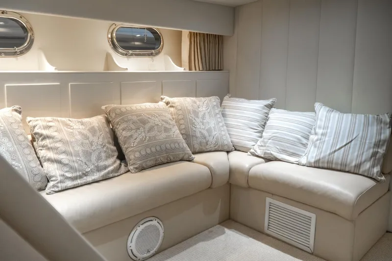  Yacht Photos Pics Luxurious interior of 1997 Magnum 56 yacht with plush cushions and elegant design.