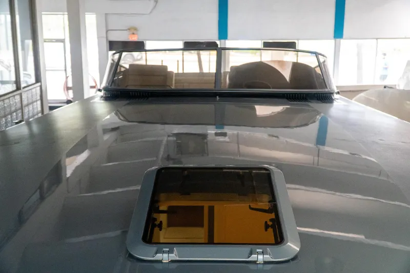  Yacht Photos Pics 1997 Magnum 56 yacht interior with sunroof, showcasing sleek design and luxury features.