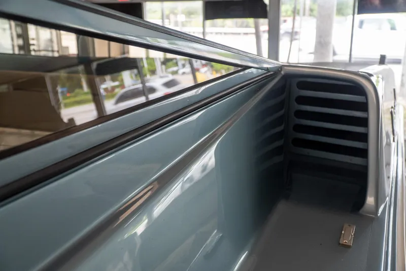  Yacht Photos Pics Close-up of a 1997 Magnum 56 truck bed interior, showcasing sleek design and metallic finish.