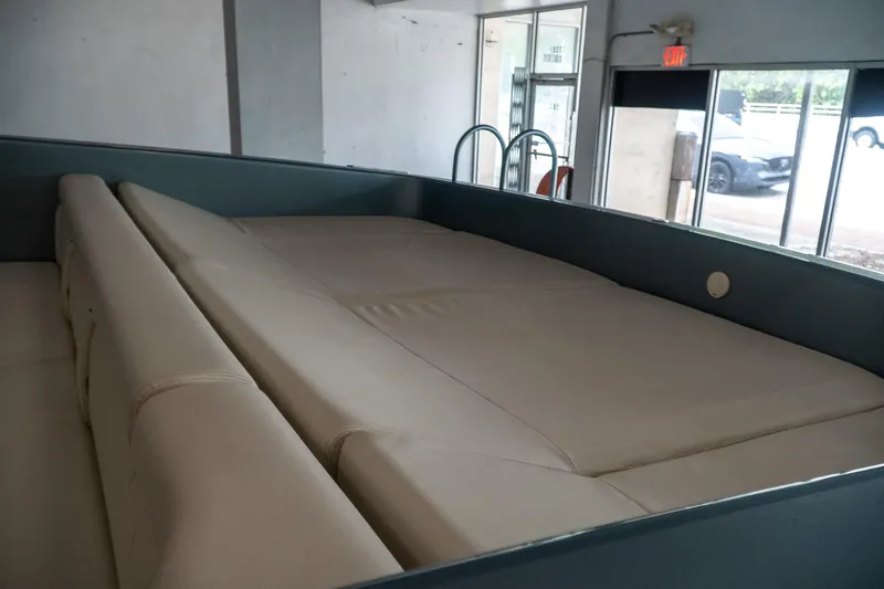  Yacht Photos Pics Interior of a 1997 Magnum 56 boat with beige seating and modern design.