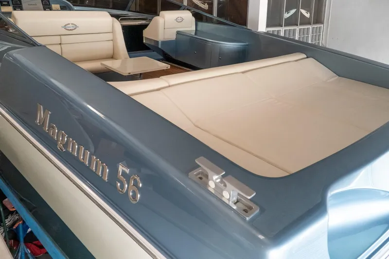 Yacht Photos Pics 1997 Magnum 56 boat interior with beige seating and sleek design.