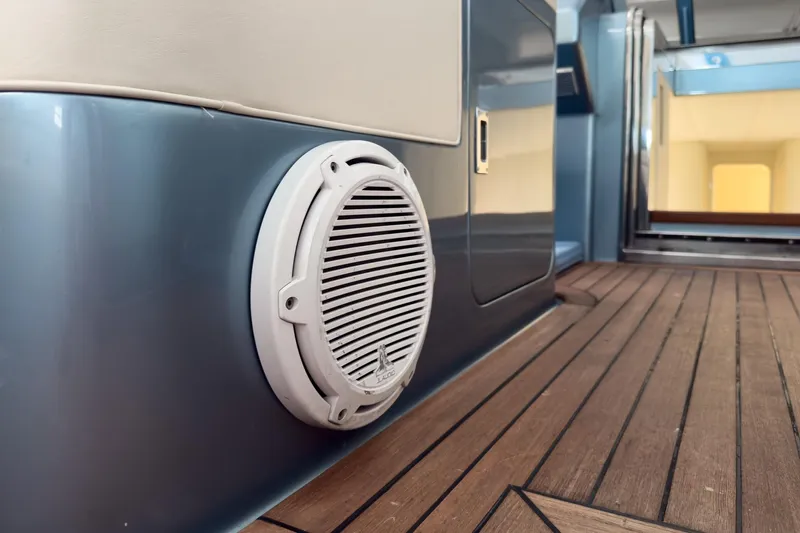  Yacht Photos Pics Interior of 1997 Magnum 56 yacht with speaker and wooden flooring.