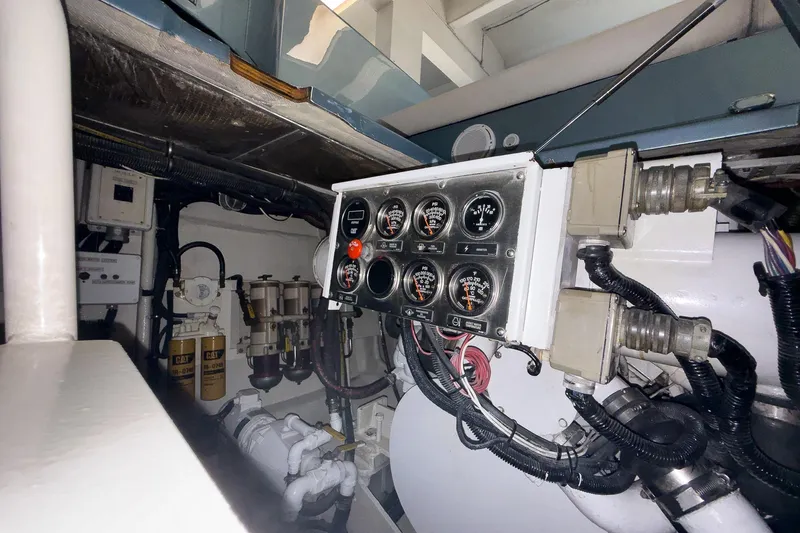  Yacht Photos Pics Engine room of 1997 Magnum 56 yacht with control panel and wiring.
