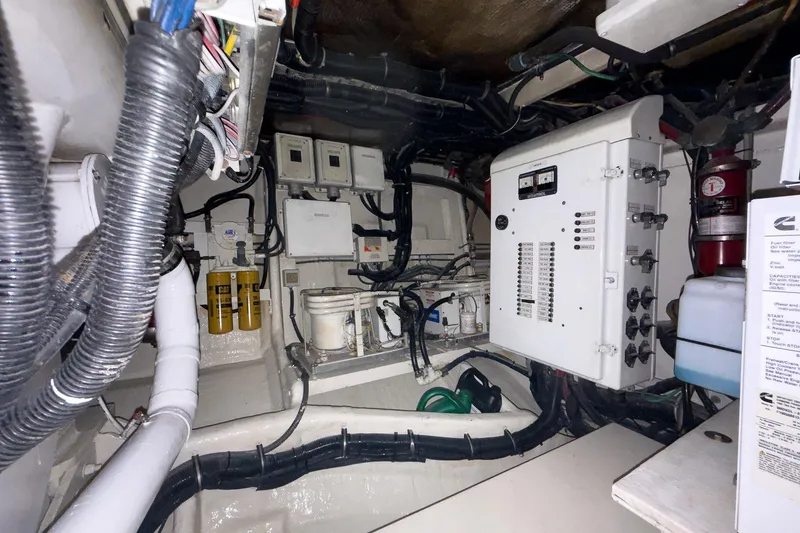  Yacht Photos Pics Engine room of a 1997 Magnum 56 yacht with electrical panels and wiring.