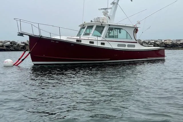 Tere Sue Yacht Photos Pics 2007 Northern Bay Hardtop Cruiser/Fishing Vessel on calm water near rocky shore.
