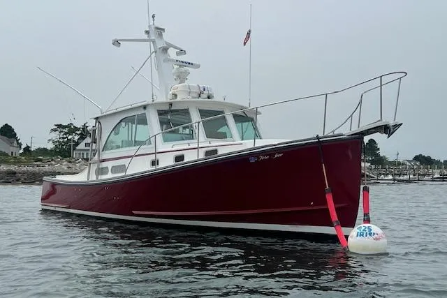 Tere Sue Yacht Photos Pics 2007 Northern Bay Hardtop Cruiser/Fishing Vessel on calm water near shoreline.