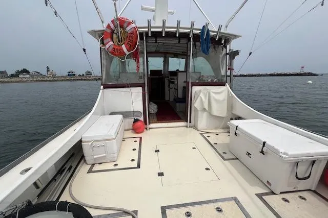Tere Sue Yacht Photos Pics 2007 Northern Bay Hardtop Cruiser/Fishing Vessel on calm water, equipped with fishing gear.
