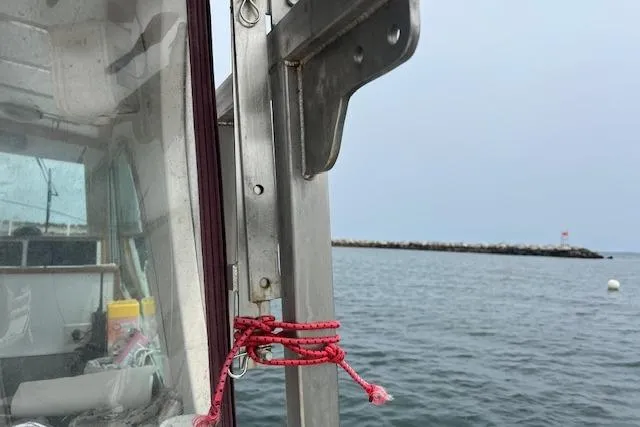 Tere Sue Yacht Photos Pics 2007 Northern Bay Hardtop Cruiser on calm waters near a rocky shoreline.