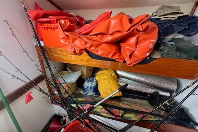 Tere Sue Yacht Photos Pics Storage area in a 2007 Northern Bay Hardtop Cruiser with fishing gear and supplies.