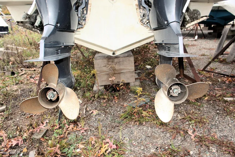  Yacht Photos Pics Twin propellers of a 2013 Pursuit ST 310 Sport boat on dry land.