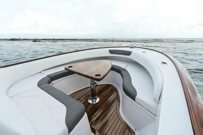 Surreel Yacht Photos Pics 2016 Bonadeo 37 Custom Carolina YT WalkAround boat with elegant seating and wooden table.
