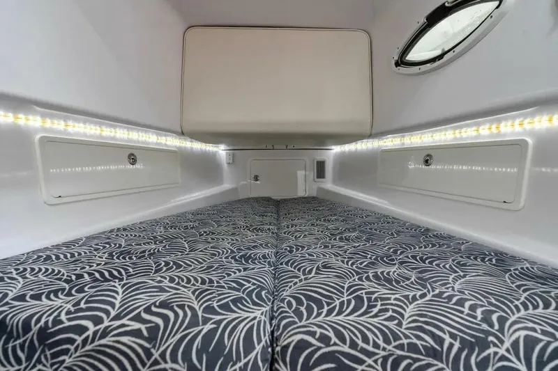 Surreel Yacht Photos Pics 2016 Bonadeo 37 Custom Carolina YT WalkAround cabin interior with patterned bedding and LED lighting.
