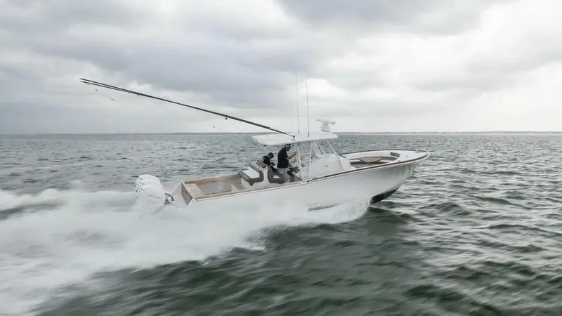 Surreel Yacht Photos Pics 2016 Bonadeo 37 Custom Carolina YT WalkAround cruising on open water under cloudy skies.