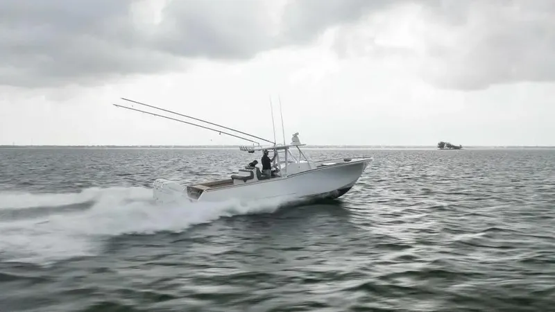 Surreel Yacht Photos Pics 2016 Bonadeo 37 Custom Carolina YT WalkAround speeding on open water under cloudy skies.