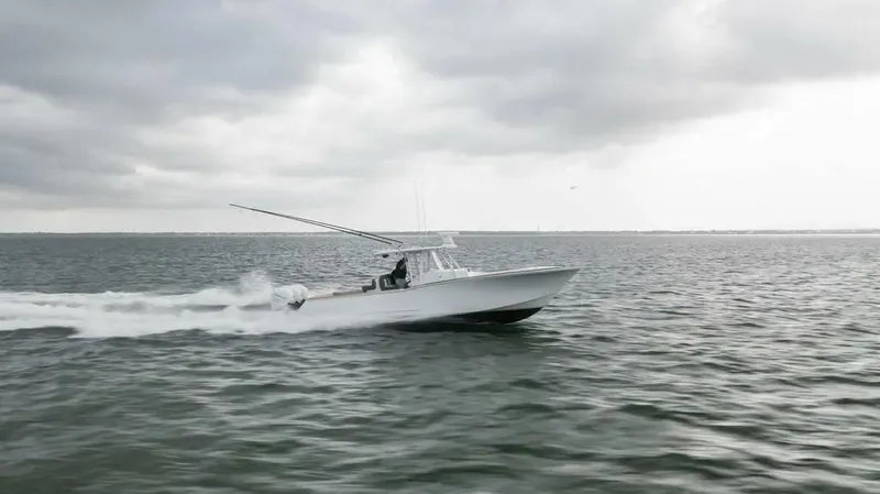 Surreel Yacht Photos Pics 2016 Bonadeo 37 Custom Carolina YT WalkAround cruising on open water under cloudy skies.