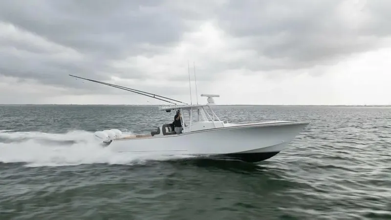 Surreel Yacht Photos Pics 2016 Bonadeo 37 Custom Carolina YT WalkAround cruising on open water under cloudy skies.