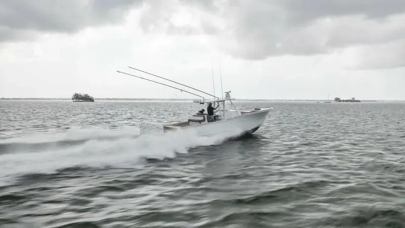 Surreel Yacht Photos Pics 2016 Bonadeo 37 Custom Carolina YT WalkAround speeding on open water under cloudy skies.