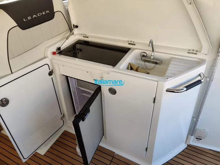  Yacht Photos Pics Outdoor kitchenette on 2020 Jeanneau Leader 36 yacht with sink, stove, and fridge.